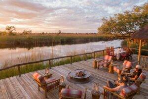 Wooden deck area overlooking the river at Camp Xakanaxa in Botswana