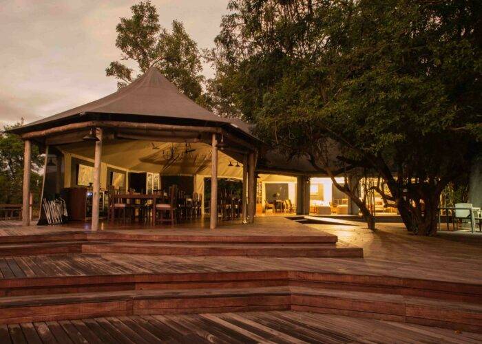 Outdoor wooden deck at Muzimu Tented Camp in Gorongosa National Park