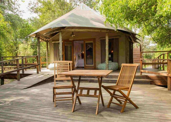 Wooden deck outside and accommodation of Muzimu Tented Camp in Gorongosa National Park